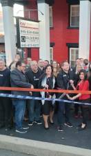 Olivero Team realtor Dierdre Wansor-Torro, center, and broker John Olivero with his wife Carol Olivero, right, at the ribbon cutting outside the new Olivero - Keller Williams office in Goshen. Photo provided.
