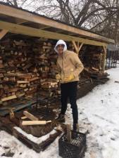 Hudson Reid, Lambert’s teenage son, whose job it is to split the kindling and keep the porch supply full.