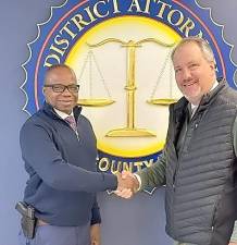 Rudolph Simmons, left, with D.A. David Hoovler, will be appointed Chief Criminal Investigator for the Orange County District Attorney’s Office