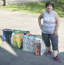 Debbie Matyus, regent of the Catholic Daughters Ct. Genevieve Walsh #918 from St. John the Evangelist Church in Goshen, collected food from several members to donate to the Goshen Ecumenical Food Pantry. Provided photo.
