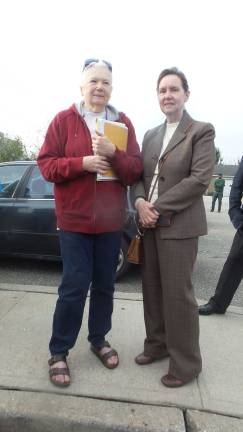 Bad acoustics frustrate both sides in BT trial Citizen Leslie Smith (left) and Village of Chester Trustee Betty Ann Riley were in court every day. They are pictured waiting outside for the all clear after someone pulled a fire alarm. (Photo by Frances Ruth Harris)
