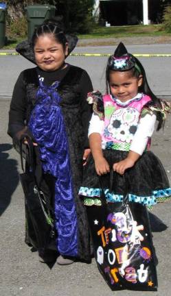 More than 400 turn out for Halloween bash Lady Vampire Nathali Luna, 5 and witch Areli Aguilar 4, of Chester