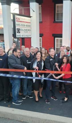 Olivero Team at Keller Williams Realty celebrates grand opening Olivero Team realtor Dierdre Wansor-Torro, center, and broker John Olivero with his wife Carol Olivero, right, at the ribbon cutting outside the new Olivero - Keller Williams office in Goshen. Photo provided.