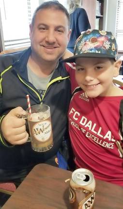 Justin Reich of Highland Mills with his dad Scott at A&amp;Wesome Aba Father’s Day event at Chabad Hebrew School.