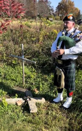 A bagpiper gives U.S. Marine Sgt. James R. Ruppert a proper sendoff.