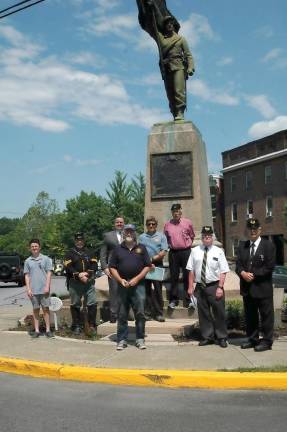Members of Augustus van Horne Ellis Camp #124 Sons of Union Veterans of the Civil War stand in front of the 124th New York Infantry monument in Goshen.