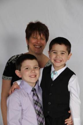 Mommy & Me Contest Liane Herman with sons Cole (8) and Logan (4). "Why we love you Mommy: Your nice, your funny, you always help us and you love us to the moon, stars, planets and back! You have nice taste. Your never a sore sport when we play games. Your smart and beautiful and we hope you and Grandma have a very nice Mother's day! Your the best Mom ever! We love you!"