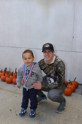 Friends' devotion to Alyssa Barberi transcends time The two Gabriels: Gabriel Burgos, 3, wears the medal given to him by Gabriel Thomas (right), the actual winner (Photo by Ginny Privitar)