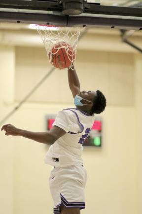 Matthew Omitiran got his teammates off the bench and the fans on their feet with this one-handed jam in the third quarter.