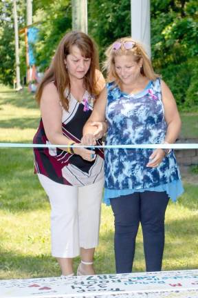 Susan Barberi and Iris Ferraro cut the ribbon on the bridge.