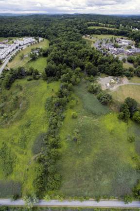 Village agrees to provide water and sewer to Legoland, if studies hold up An aerial view in Goshen of the property between the Arcadia Hills Complex top left and Elant top right with Harriman Drive on the bottom (By Robert Breese)
