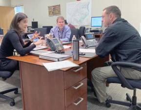 Orange County Executive Steven Neuhaus speaks with Health Commissioner Dr. Irina Gelman and County Attorney Langdon Chapman on Sunday, March 15, in the Emergency Services Center Command Center in Goshen.