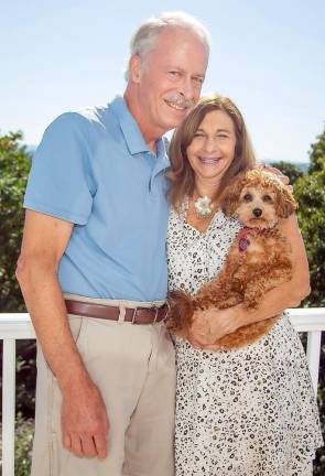 Mark and Andrea Baker and their puppy, Bobbi, at home in Goshen.