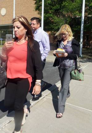 Horse deaths trial wraps up From left, leaving court on Monday, are Jeanne Ryan's hairdresser; her new husband, Stanley Dickel, and Ryan. (Photo by Frances Ruth Harris)