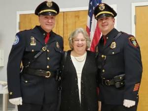 L-R: Outgoing Police Chief James Watt, dispatcher Bonnie Remer and incoming Police Chief Ryan Rich.