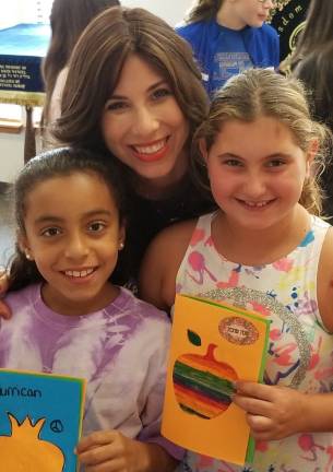 All are welcome at High Holiday Services and children’s programs at Chabad Chabad Hebrew School students Skylar Shaw and Abby Ohren, both of Highland Mills, create Shanah Tovah cards with Chana Burston at a Chabad Hebrew School High Holiday fair.