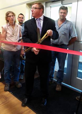 Chester celebrates brand-new senior center Town supervisor Alex Jamieson cuts the ribbon to Chester’s new senior center as town board members Cindy Smith, Ryan Wensley, and Robert Valentine look on (Photo by Frances Ruth Harris)