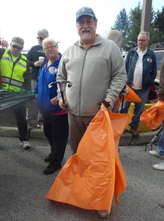 Many hands made light(hearted) work Orange County legislator John Vero (Photo by Frances Ruth Harris)