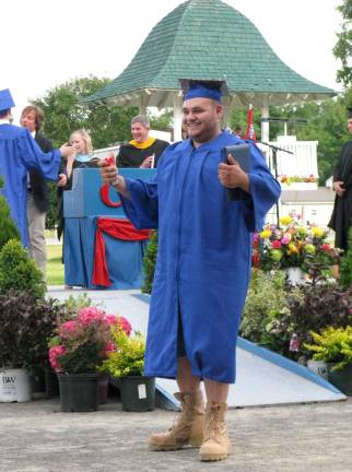 Goshen's Class of 2014 Robert Fesko, tooting his own small red horn with joy.