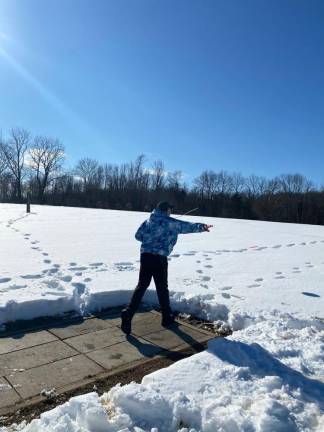 Meet the poster children of disc golf Dan Doyle, owner of the Oasis, a disc golf center in Warwick, N.Y., after throwing a disc in the snow.