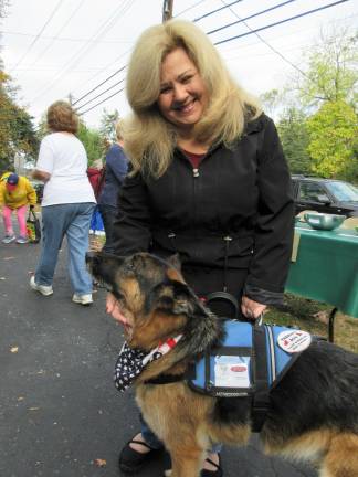 A blessing for Princess Buttercup, and other bright creatures Marie Threlfal of Warwick with therapy dog Katy Lynn, a German Shepherd (Photo by Ginny Privitar)