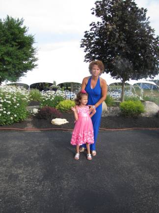 Hope grows for Eva Fini Eva Fini with her mother, Aimee (Photo by Edie Johnson)