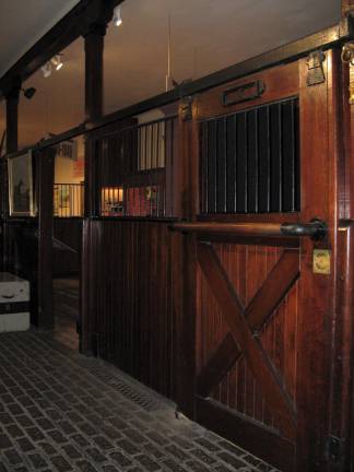 A stable fit for a king View of fine wood and ironwork in the stable, with its cobbled floor and diamond-patterned drain work (Photo by Ginny Privitar)