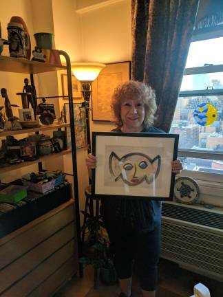 making art in chelsea Eileen Millan at home in the Vermeer, with a framed painting of her iconic image. Photo: Liz Hardaway