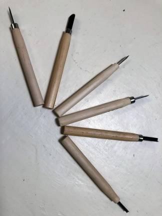 Alternative printmaking methods Some of the tools for making a collagraph.