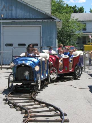 Great American Weekend brings on the crowds A ride in an old-fashioned car.