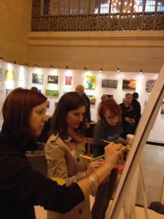 'Know there is hope' Many people lined up to contribute a few paint strokes to Ellen Mayer's creation "Balancing Act." (Photo courtesy Ellen Mayer)
