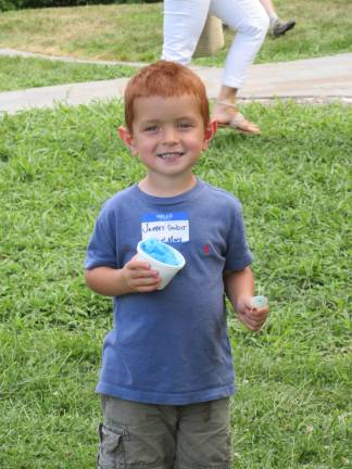 A great day for the Bull family James Condit, 3, enjoyed his blue Italian ice and his first time at a Bull family reunion. (Photo by Ginny Privitar)