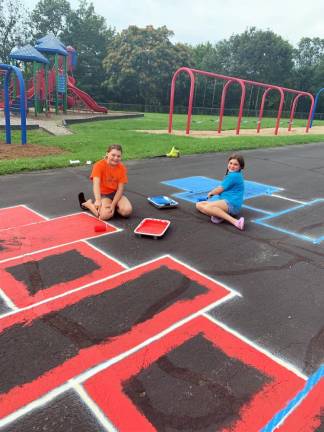 The Scouts even painted permanent picture frames that kids can draw their art work in with chalk day after day.