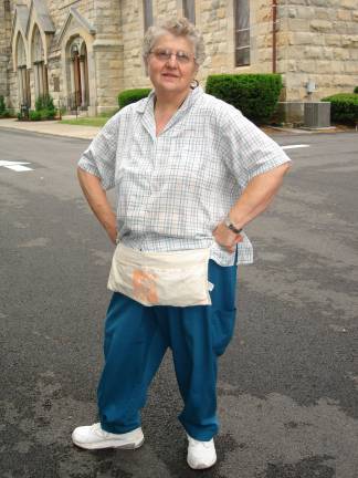 Creating safe places, one house at a time A proud Carol Gabella of Middletown is all ready for work. (Phot by Geri Corey)