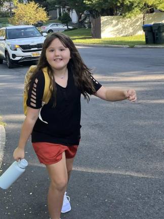 Smiling through the first day of school Korra steps into third grade.