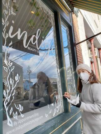 Chester Academy art student Angelina Zaporotjsev pauses a moment for the camera outside of the Indigo Beauty Salon.