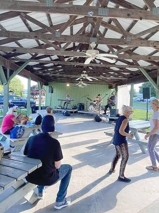 Playing at the pavilion in Pine Island were Mike Jackson, Rave Tesar and Jeff Siegel.