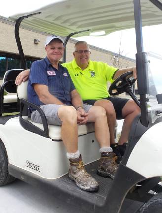 Louis Frenette, groundsman (left), with Coach Tom Gilbert