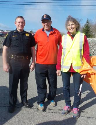 Many hands made light(hearted) work Chief of Police Dan Doellinger with Town Supervisor Alex Jamieson and Councilwoman Cindy Smith (Photo by Frances Ruth Harris)