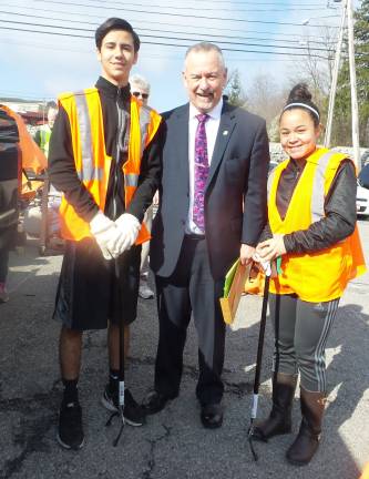Many hands made light(hearted) work Mike Flynn, organizer of Chester's spring spruce-up, with two eager volunteers (Photo by Frances Ruth Harris)