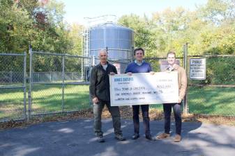 Senator James Skoufis presents a $130,000 grant to fund the Walton Lake Estates water system rehab to water administrator Tom Becker and councilman Brandon Holdridge