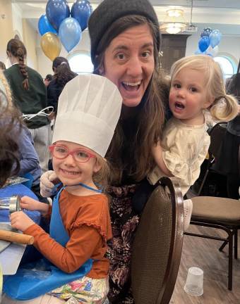 Families bake Hamantashin in preparation for Purim holiday