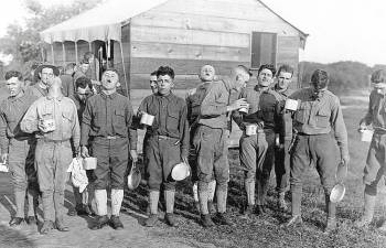 Soldiers gargle with salt and water to prevent influenza. Sept. 24, 1918. Camp Dix, New Jersey, during the 1918-19 Spanish Influenza pandemic.