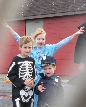 Chester celebrates the haunting season Harrison Annucci, 7, and brother Oliver, 3; with Talia Pegg, 9, behind them (Photo by Ginny Privitar)