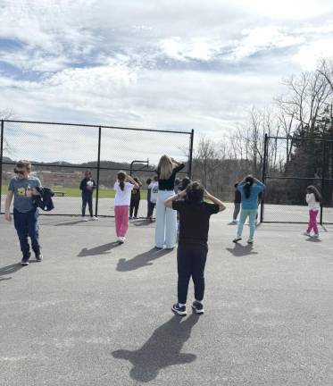 Chester Elementary School students watched as the moon blocked light from the sun.