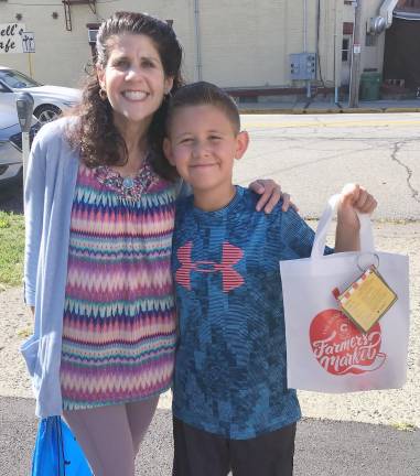 Joseph Kahn with his mom at Rosh Hashanah farmers market