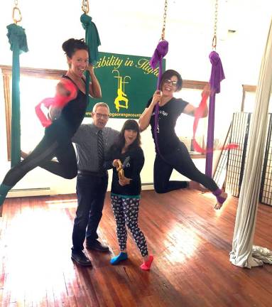 Flexibility in Flight celebrates grand reopening of new studio Photo provided by Bea Arner On Wednesday, July 11, Flexibility in Flight owner Terra Meierdierck (center), Studio Manager Jessica Scirbona (far right) and Aerial Instructor Janalee Wedenko (far left) was joined by Warwick Valley Chamber of Commerce Executive Director Michael Johndrow to celebrate the grand reopening of the aerial studio located at 49 Main St. in Chester.
