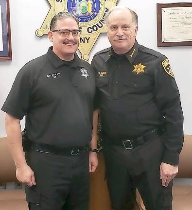 Sheriff commends corrections officer David Colon for 25 years of exemplary service Officer David Colon (left) with Sheriff Carl DuBois