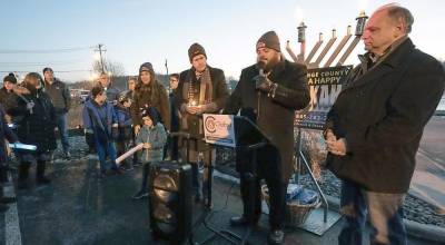 Rabbi Pesach led a special “Menorah Message, Meditation and Memorial.” Monroe Village Mayor Neil Dwyer and Monroe Town Supervisor Tony Cardone stand beside him.