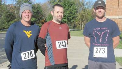 The top three overall finishers, from left: Ryan Stover, second place; Evan Morgan, first place; and Joe Clarke, third place.
